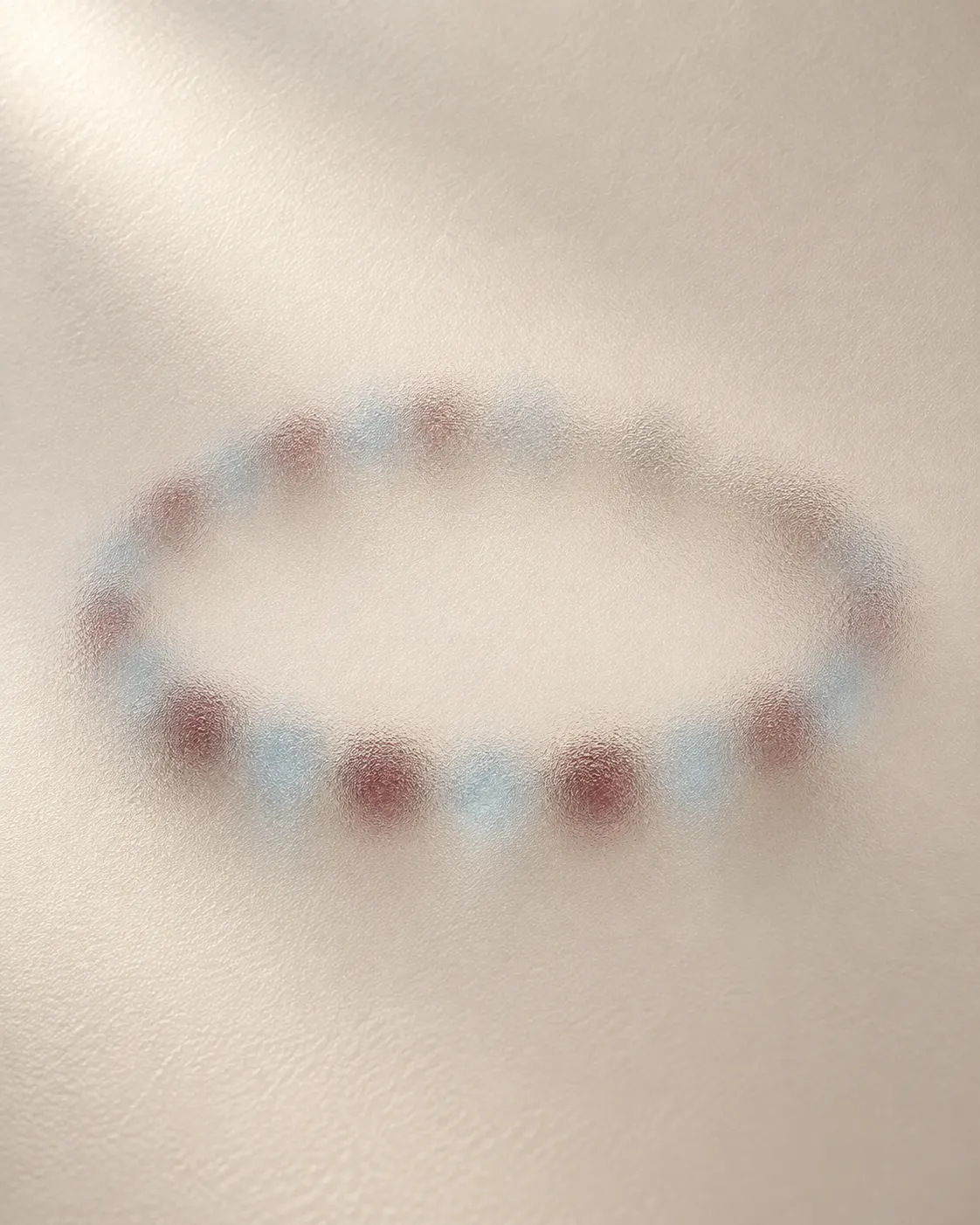Original soft-focus preview of wine-red and ice-blue colours; jewellery design concealed.