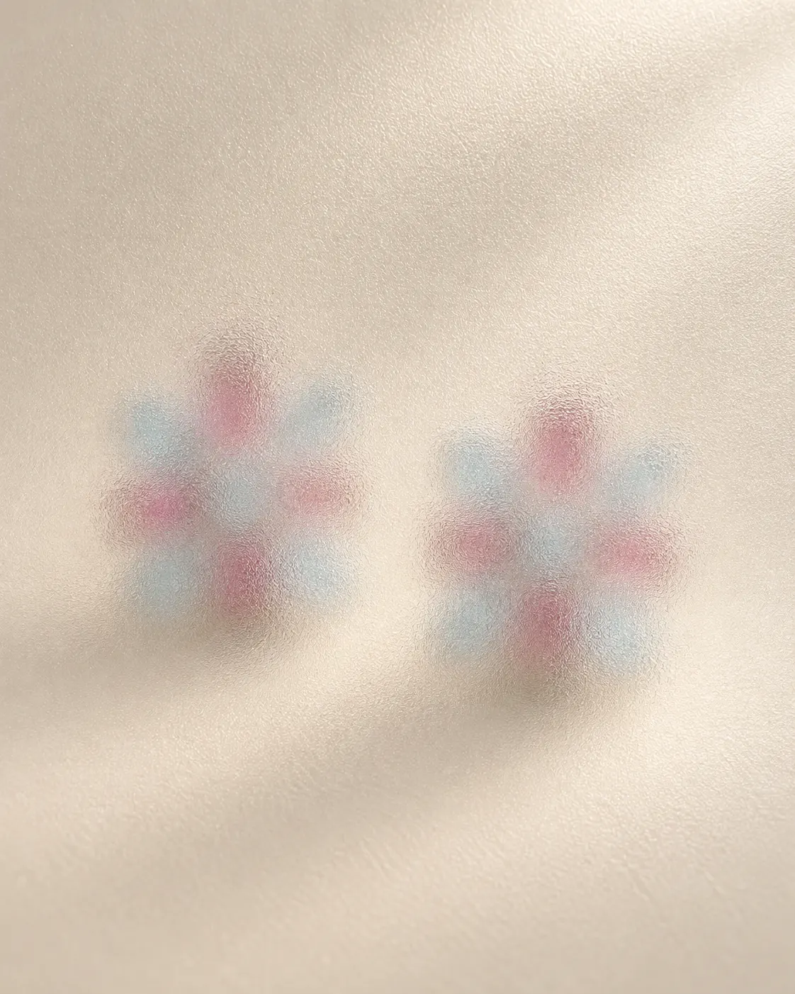 Original soft-focus preview of blush and blue colours; jewellery design concealed.